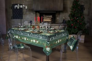 Elegant Christmas table set with green Beauvillé tablecloth in a cozy Alsace dining room