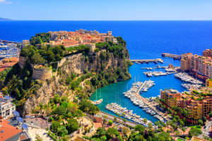 Aerial view of Monaco’s harbor, cliffs, and old town
