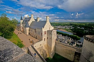 View from the ramparts of Chinon Royal Fortress, overlooking the medieval town and the Vienne River in the Loire Valley.
