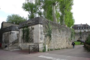 Stone ramparts and tree-lined walkway in Beaune, Burgundy, France