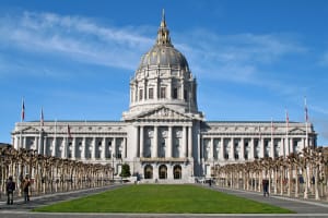 San Francisco City Hall with iconic white dome and classical architecture under blue sky