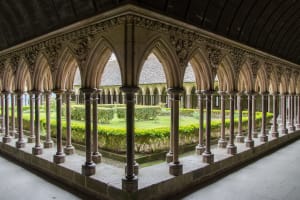 Cloister garden and arches inside Mont-Saint-Michel Abbey
