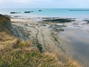 Concrete Mulberry Harbour caissons in the sea off Arromanches beach