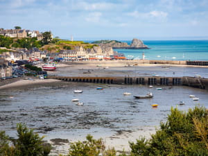 Cancale fishing harbor with oyster beds visible at low tide