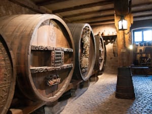 Wine barrels inside an Alsace winery cellar