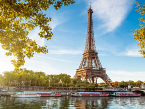 Sightseeing boat cruising on the Seine with the Eiffel Tower in the background
