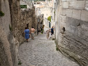 Stone streets and historic buildings in Les Baux-de-Provence explored during a day trip from Aix
