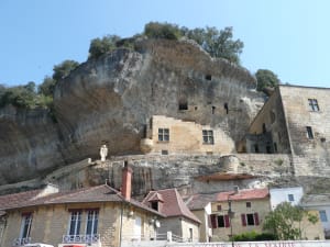 Village of Les Eyzies built beneath limestone cliffs