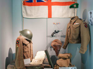 Mannequins in uniform with personal items in a life-size Overlord Museum diorama