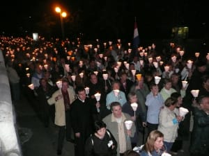 Pilgrims holding candles during Lourdes procession