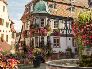 Colourful half-timbered houses in a typical Alsace wine village street
