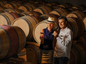 Oak barrel cellar used for aging Médoc wines visited on a guided wine tour from Bordeaux