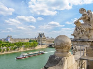 Sightseeing boat cruising along the Seine River in Pariss
