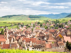 Traditional Alsace village surrounded by vineyards visited during a wine tasting tour from Strasbourg