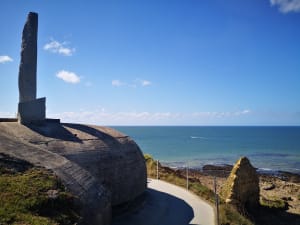 Walking path along the edge of Pointe du Hoc with sea in the background