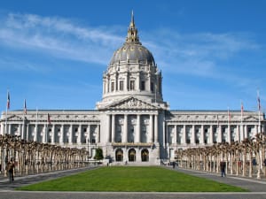 San Francisco City Hall with iconic dome and classical architecture under blue sky