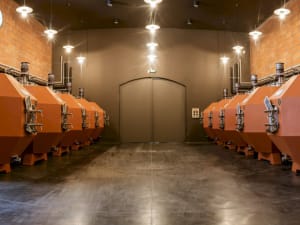 Modern fermentation tanks inside Château Haut-Bages Libéral winery in Pauillac