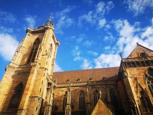 View of Saint Martin Church’s Gothic facade and tower against a blue sky