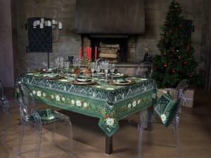 Elegant Christmas table set with green Beauvillé tablecloth in a cozy Alsace dining room