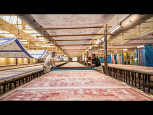 Artisans printing Beauvillé table linen in a traditional Alsace textile workshop