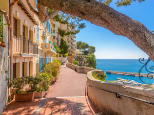 Sunlit promenade in Monaco overlooking the Mediterranean Sea