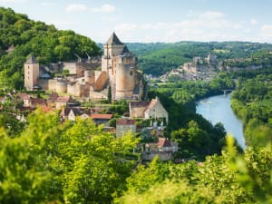 Château de Castelnaud overlooking the Dordogne River and green valley near Castelnaud-la-Chapelle