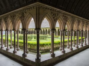 Cloister garden and arches inside Mont-Saint-Michel Abbey