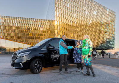 A tour group in front of the Harpa Concert Hall in Reykjavik 