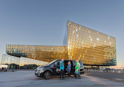 Group of travellers meeting the Guide from Your Friend in Reykjavik in front of the Harpa Concert Hall 