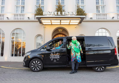 A traveller entering a tour vehicle from Your Friend in Reykjavik 