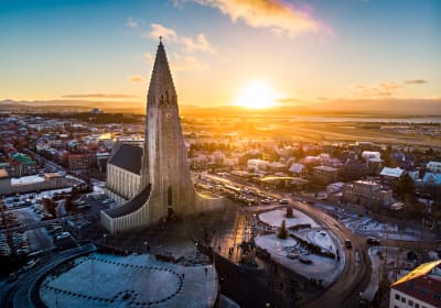 An aerial shot of Reykjavik City with Hallgrimmskirkja in the focus 