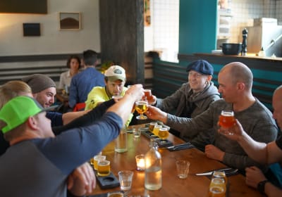A group of travellers performing a "cheers" gesture together.