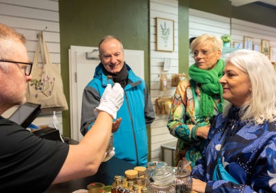 Travellers tasting different samples of Icelandic sweets. 