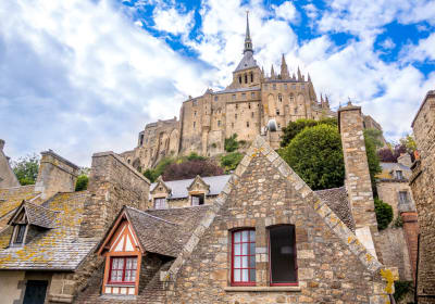 Gothic abbey towering above Mont-Saint-Michel village