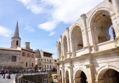 Historic streets and Roman heritage in Arles explored during a small group tour from Aix-en-Provence