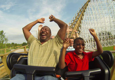 front seat on the wooden rollercoaster, 2 passengers enjoying the ride