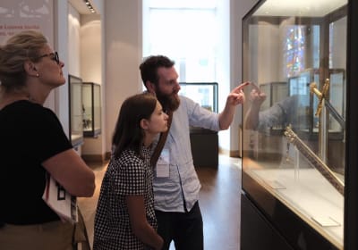 Visitors viewing an exhibit at the Musée de l’Armée