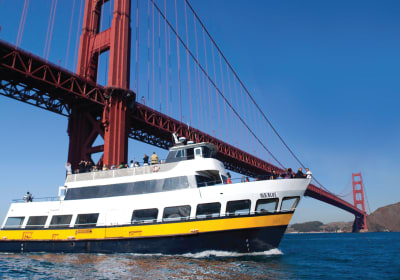 Ferry boat 'Old Blue' passing under the Golden Gate Bridge in San Francisco Bay