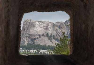 Doane Robinson Tunnel on Iron Mountain Road with a view of Mt Rushmore