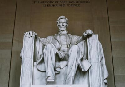 The seated statue of Abraham Lincoln inside the Lincoln Memorial at the west end of the National Mall in Washington, DC.