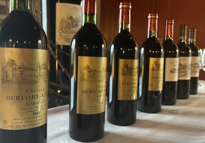 Seven bottles of Château Durfort-Vivens spanning multiple decades for private vertical wine tasting in Margaux