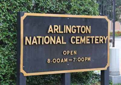 The Arlington National Cemetery sign marks the entrance to the historic military cemetery in Arlington, Virginia, near Washington, DC.