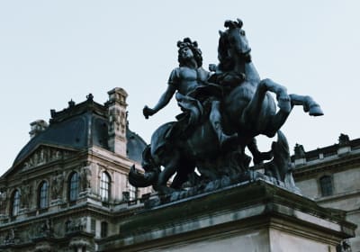 An equestrian statue of Louis XIV outside the Louvre Museum
