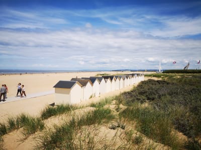 Peaceful coastline of Omaha Beach today contrasting with historic events of D-Day
