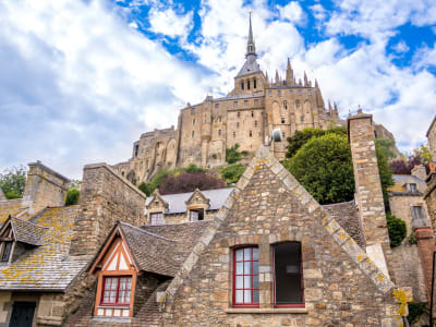 Gothic abbey towering above Mont-Saint-Michel village