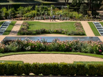 Formal lawn, rose beds and water features in the gardens of Château des Milandes