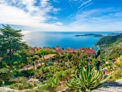 Mediterranean Sea view from the Exotic Garden of Èze, with agaves and cacti in the foreground.