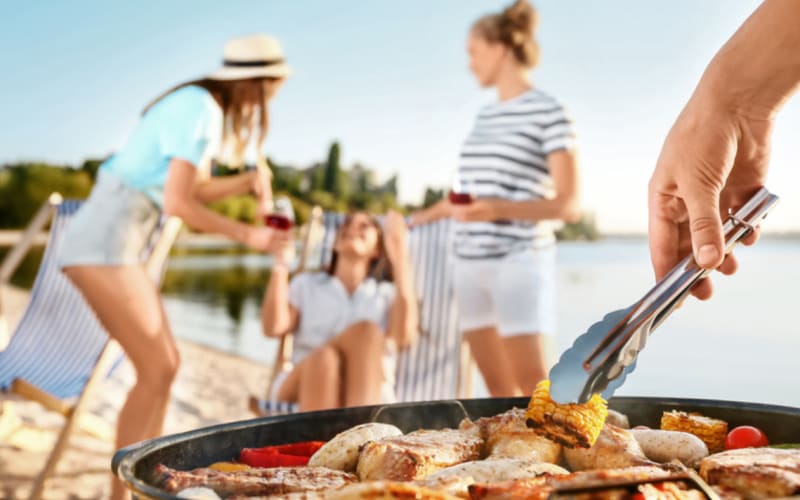 Group of friends enjoying a cookout on New Smyrna Beach, Florida.