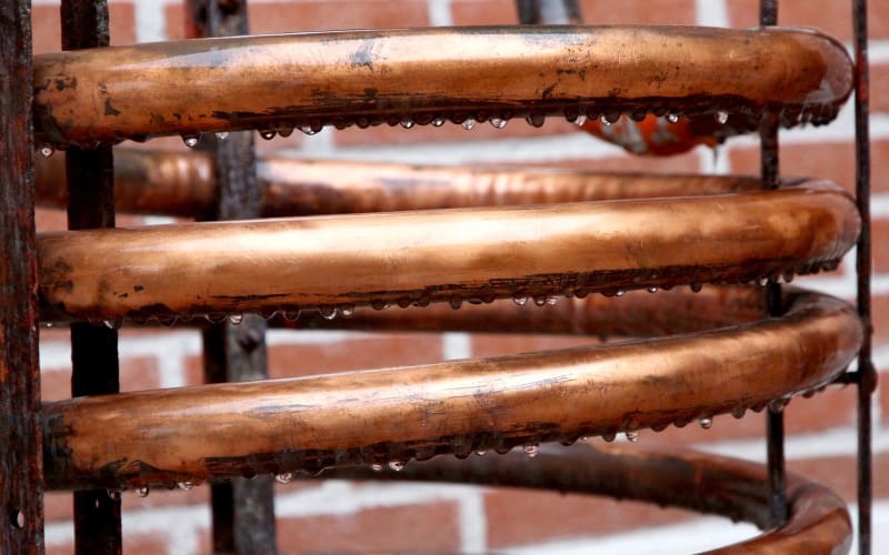  Historic copper alembic still used for continuous distillation of Armagnac brandy in France
