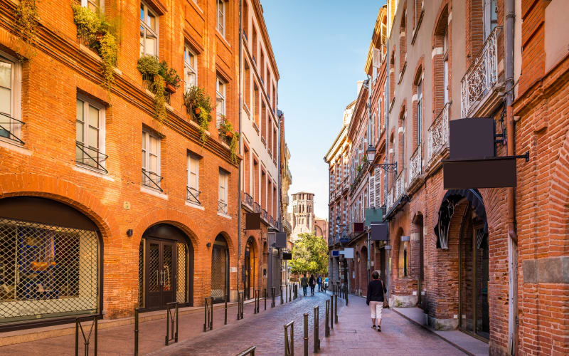 Colourful pink-brick façades and balconies in central Toulouse
